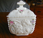 Hand painted Westmoreland Milk Glass covered jar. c:1940's-1982 mark. Beaded grape pattern; no chips or cracks; features pink roses, leaves and grapes. It is shown in the book on milk glass. It stands...