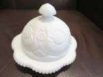 Vintage McKee milk glass butter dish. Very nice butter dish. No chips or cracks. All I can make out is the work 'cut' on the bottom interior of dish; I think the word 'Pres' just didn't come out on th...