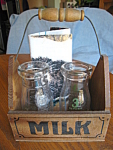Vintage milk bottles, a cute little wood basket and a kitten linen towel. These are vintage 1/2 pint glass milk bottles, likely antique. One is a 3 cent bottle, other is a 5 cent bottle. You also get ...