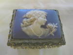 Vintage musical jewelry box. Very feminine box. Has the word Japan on bottom. Not sure what tune it plays, but it does play. The winder is on the interior lid. This box is 2.25 tall x 3.5 long x 2.75 ...