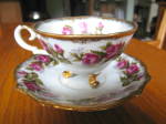 Very attractive footed teacup with hand painted Napco backstamp. No chips or cracks; saucer is 5.75 wide; cup is 4 wide x 2.5 tall. Features gold trim and deep pink roses. The perfect feminine gift! g...