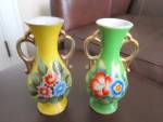 Occupied Japan porcelain vases. Both vases for one price. Very colorful vases. No chips or cracks. Some stray gold paint as shown in one of the photos. Hand painted under glaze. They are 5.75 tall. Ve...