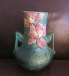 Vintage Roseville Clematis vase. c: 1944. Lovely teal green vase; heavy and well made. One side is great, the other side has a couple of minor flaws, (see photos 4,5,6). This vase has the raised Rosev...