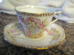 Vintage Rosina bone china English teacup. c:1948. Brown backstamp. Very nice; scalloped edge; pastel flower bouquets. Cup is 2.5 tall x 3.25 wide; saucer is 5.5 wide. No chips or cracks. Teacups make ...