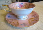 Royal Bayreuth occupied zone German teacup.  Lovely teacup with gold trim and pink and blue flowers. The saucer is almost 6 wide; cup is 4 wide x 2.5 tall. No chips or cracks. Aqua backstamp: Royal Ba...