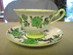 Striking vintage Shelley pedestal teacup. c: 1945-66. 'Ovington' is the pattern name which looks very Asian inspired. The green on the flowers feels like raised enameling. No chips or cracks. Saucer i...