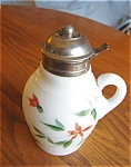 Patented antique Victorian hand painted milk glass syrup pitcher with applied handle and metal lid. The lid is likely EPNS, possibly pewter lid. Incised mark on lid: Pat's Apr. 26, 81, (1881); Mar 28,...