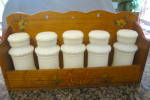 Vintage spice set. This is a small wood rack that can be hung or not. It has a remnant of an old Japan label on the back, see pic #4. There are 5 milk glass spice jars without labels. All the jars hav...
