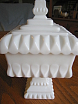 Vintage Westmoreland milk glass covered jar. c:1940's-1982 mark. Very heavy and attractive covered jar/candy dish, with Westmoreland logo on interior lid. No chips or cracks; stands 8.5 tall x 4.5 wid...