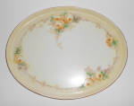 This is an offering for a lovely Tressemann & Vogt 12-1/4" by 9-1/2" rose decorated platter or tray.  Marked T & V Limoges France.  There is light wear to the gold band only and has no nicks...
