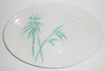 This is an offering for a rarely seen Wallace China green bamboo 13-1/8" by 9" platter.<BR><BR>Ink marked 'WALLACE CHINA LOS ANGELES CALIF'.<BR><BR>There is just the smallest hint of surface...