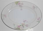 This is an offering for a pristine Noritake China 11-3/4" by 8-3/4" platter in the lovely pattern known as Noritake Mystery #1.  The pattern is of pink carnations with a light yellow shoulde...