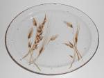This is an offering for a Midwinter Pottery pristine 12'' by 9-5/8'' platter in the lovely Wild Oats pattern.<BR><BR>Not a hint of use and has no nicks, chips, cracks or repairs.<BR><BR>Shipping for t...