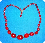 Cherry Amber Graduated and Faceted Necklace 18 inches beads from 15 mm X 20 mm to 5 mm X 8 mm.  The Color is not a Deep Red in color needs to be restrung. (priced it accordingly)