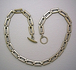 Heavy Sterling Silver Oblong Link hand Made Chain necklace. The necklace is NOT marked Strling anywhere that I can find, but I guarantee it to be so. It is 19 inches end to end,3/8 of an inch wide and...