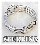 Sterling Silver and Brass bracelet hinged modern design signed Far Fan 925 and another signature that I cannot read. 5/8 of an inch wide and is approx 7 1/2 inches 48.4 grams. 