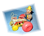 Fisher Price 61 Farmer on Tractor Pull Along Toy. The toy is in great condition for its age, and the paper on the tractor is not ripped. Both the front wheels are wood, and the two back ones are plast...