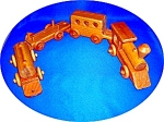 Handcrafted Wooden Pull Train. Each piece slots one onto the other, and all the wheels go round. The train is 25 inches end to end whan the 4 pieces are slotted together. The tallest is approx 4 inche...