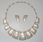 Sterling Silver Mexican Vintage Necklace Signed Sterling RIVERAS. The necklace is 16 1/2 inches end to end, and is strung on chain. It is 1 1/2 inches at the widest part in the center, and has Sterlin...