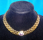 Fabulous Necklace by PANETTA. The necklace is 16 Inches, and there is a Large Oblong Amethyst Stone set in the center of the woven goldtone which is  Surrounded by Sparkling Crystals. It  is marked Pa...