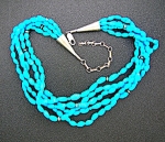 Native American Turquoise 5 strand necklace with Sterling Silver bead spacers and 4 1/2 inch extender with silver points Turquoise beads are approx 3/8 of an inch shown it with a large pendant which i...