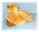 Soft and Cuddly Duck by Gund. The duck is NOT pellet filled, so would be soft and Cuddly  to tuck under a childs arm. It is 13 inches nose to tail, and 9 inches tall.