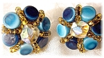blue glass goldtone set clip earrings marked on the backs of the clips JAPAN. The stones are pale and dark blue, with a borealis type crystal in the center of the earring, and tiny wired glass beads b...