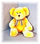 a Golden Russ Berrie Teddy Bear that I purchased in England. He is pellet filled and is called KIPLING He is 13 inches tall, and has a checked ribbon.