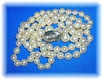 Fabulous Antique 32 Inch Strand of Graduated Cultured pearls. The pearls graduate from 7mm to 10mm, and they are handknotted. The Lustre and Color is Great.  The push clasp is NOT marked. I think it i...