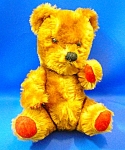 English Golden Mohair 11 Inch Teddy bear Red Felt Paws Fully Jointed he has a squeaker when his chest is squeezed the head is quite large for his body he has a sweet face with a hand stitched nose