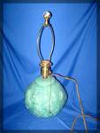 this green Majolica lamp is in very good condition.  The electric cord is the original and show fraying.  The fittings are original and in good condition.  The fitting on the top that secures the lamp...