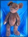 Fully jointed VERY large 23 inch brown Teddy bear with button eyes.  Leather paws on his front feet and lives in a smoke free home