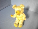 Old teddy bear cloth label on it's side 'Made in Japan'. It is either a stiffer plush or mohair and he is straw stuffed ears are wired his paws are velvet  11 inches tall and 7 inches wide the face is...