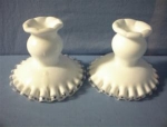 Milk glass candle holders in perfect condition 4 3/4 inches wide 3 3/4 inches tall. 