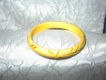 Carved creamy/yellow Bakelite bangle bracelet crosses and leaves 1/2 inch wide. 