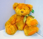 15" tall, jointed bear.<BR><BR>Made of fluffy green and orange coloured plush. He has cordroy paw pads and is polyester stuffed. He has a handstitched nose and hard eyes.<BR><BR>No longer made by...