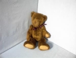 a chocolate brown BOYDS teddy bear, that is the bear in the series Bear/rabbit/cat/dog/sheep/lion. The bear is the collectible 1985. He is bean filled and is 20 inches tall. He does have his cloth tag...