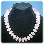 Necklace 21 Inches Faceted Genuine Rose Quartz individually hand knotted with a Sterling Silver Toggle clasp. Each of the Beads are 3/4 of an inch wide. 