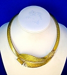 Vintage Unmarked Stylish 16 Inch Gold Omega Leaf Necklace. The necklace has a flip clasp., and it is 1 1/2 inches at the widest part of the feather. The actual Omega is 3/8 of an inch.