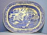 Large 18 inch by 14 inch serving Willow Pattern platter from England has the letters H & K in a scroll and the number 16 (I think, see picture)on the back.  There are not cracks.  The platter has craz...