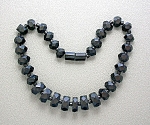 40s faceted Black Bakelite Beads with large twist barrel clasp in Bakelite 15 inches long and graduated smallest 1/4 inch long and 1/2 inch wide the largest center bead 1/2 inch long and 3/8 of an inc...