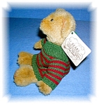 7 inch Teddy Bear by Russ Berrie with his original paper label and wearing a green and rust sweater. He is cute and comes from a smoke free home.