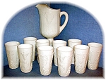 this is a beautiful set of Milk Glass harvest grape pattern Pitcher and 10 matching glasses.  The pitcher measures 11 inches at the spout and is 6 inches across.  Spout to handel measures 9 inches.  E...