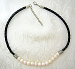 Freshwater Pearls and Black Leather Necklace that is 18 inches end to end with a lobster clasp. The combinati9on of the Pearls and Leather gives a great look 