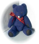 a beautiful old soft and cuddly Dark Bright Blue Felt Teddy Bear , with jointed arms and legs, black felt paws and feet, and a white felt nose, and hand sewn mouth. He has a tartan ribbon around his n...