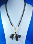 Gold (Not tested for 14K)Spacer Beads with Ivory Bone and Onyx Panther Pendant. No clasp 26 inches long Beads 2 5/8 inch long and 3 inches wide Panther.