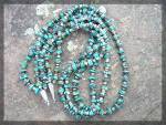 3 Strand Dark blue and Tan heishi American indian Necklace The Turquoise is rounded and Flat with beautiful Dark matrix. There are Sterling Silver points and a Hook Clasp. The Necklace is 26 Inches.