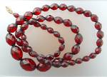 Cherry Amber Faceted and Graduated 26 Inch necklace. It has been Re Strung the Fish Hook Clasp is base metal.