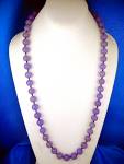 Hand Knotted Lavender Jade Necklace 28 inches with 12mm Beads. There is No C clasp won the necklace and it slips over the head.
