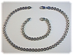 Sterling Silver 17 inch Necklace marked 925 Italy with a matching 7 1/2 inch Bracelet. Both Pieces have lobster clasps, and they are 3/8 of an inch wide. The links are a heavy mesh design 25.3 grams. 